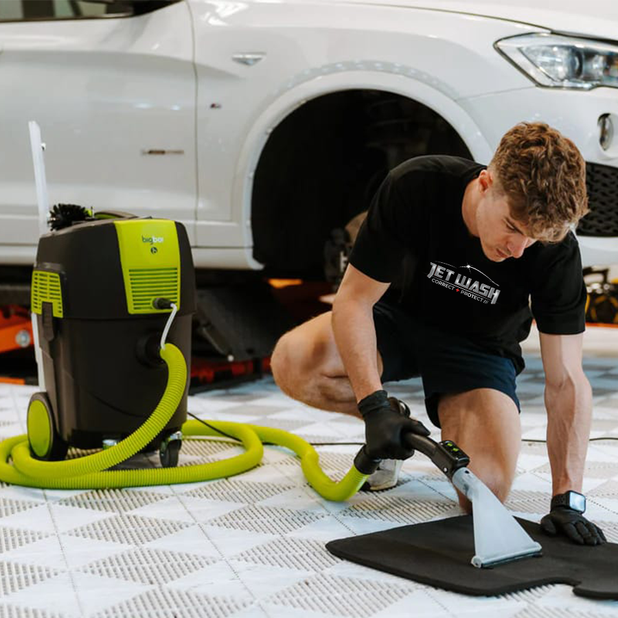 Vacuuming car mat for mini detail holden